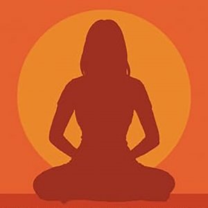 silouhette of a person meditating in front of a circular form that could be the sun or the moon