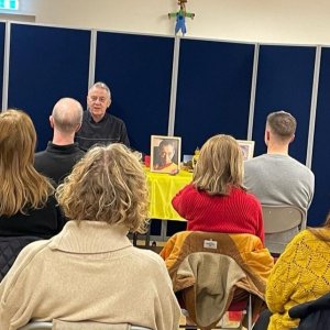 a mixed group of people listening to a talk on Buddhism and Meditation at a meditation class in Denby-Dale Library